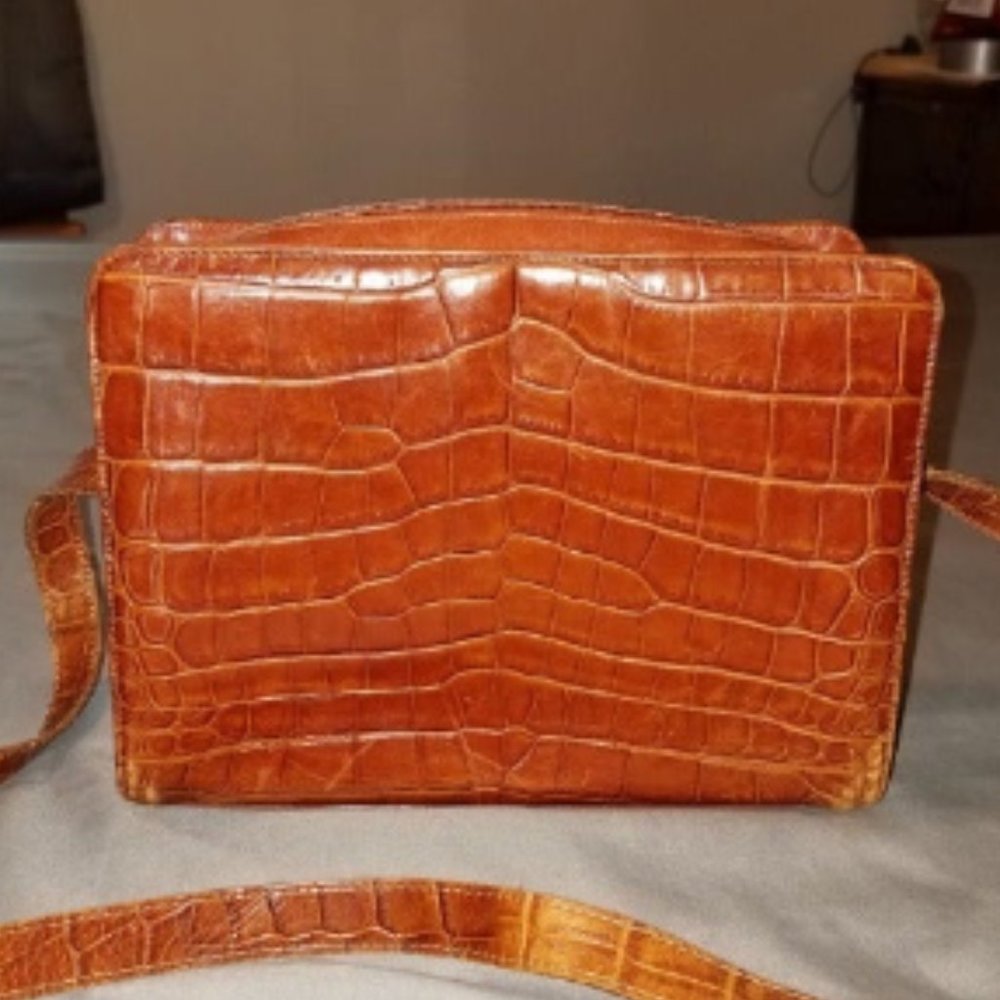 Vintage Carlos Falchi brown leather purse.